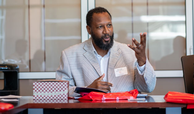 Principal at table talking